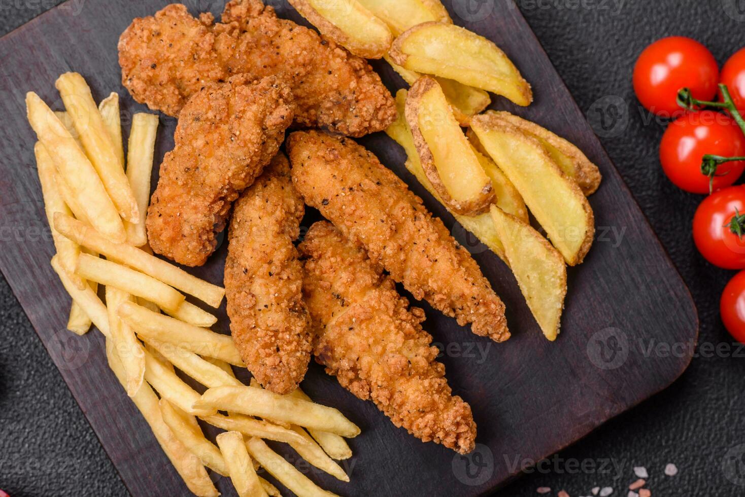 Delicious crispy chicken nuggets breaded with salt and spices photo