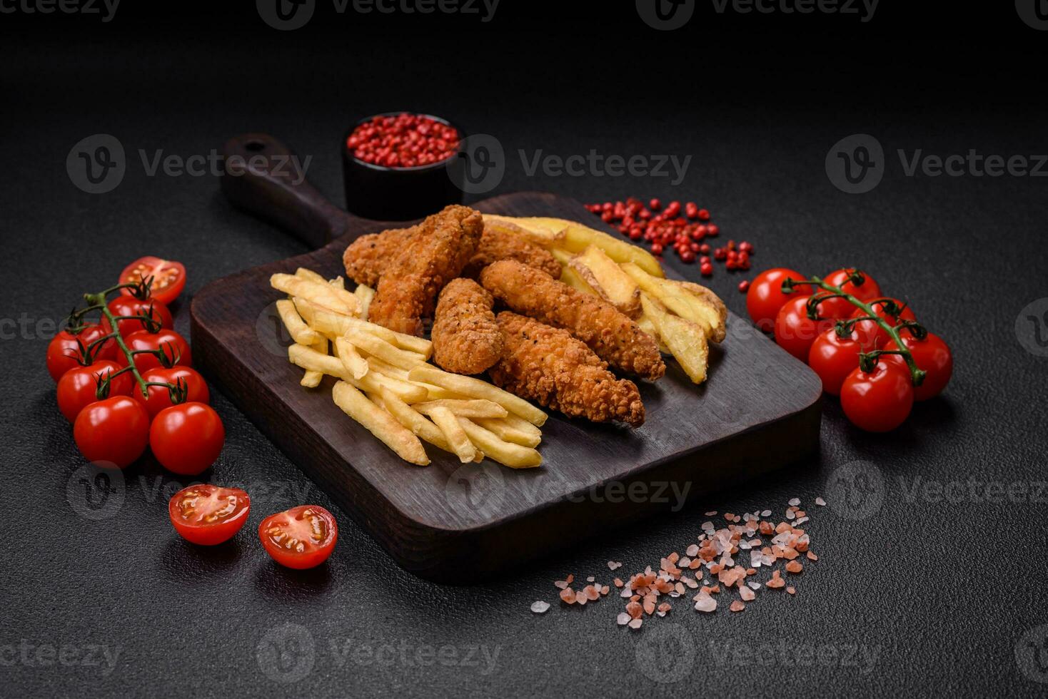 Delicious crispy chicken nuggets breaded with salt and spices photo