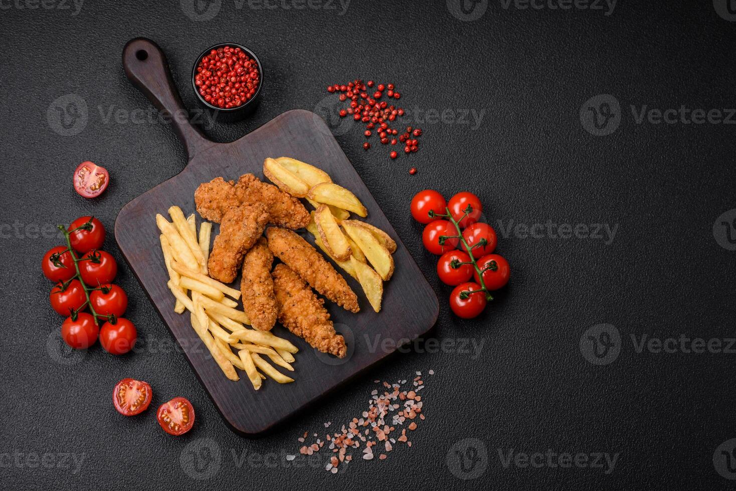 Delicious crispy chicken nuggets breaded with salt and spices photo