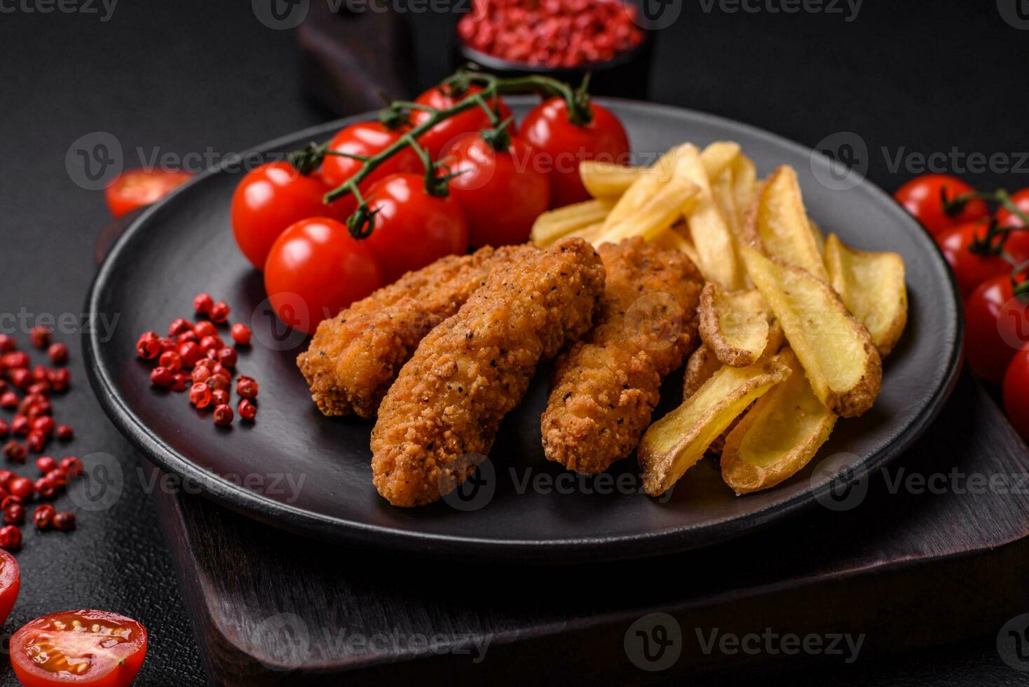 Delicious crispy chicken nuggets breaded with salt and spices photo