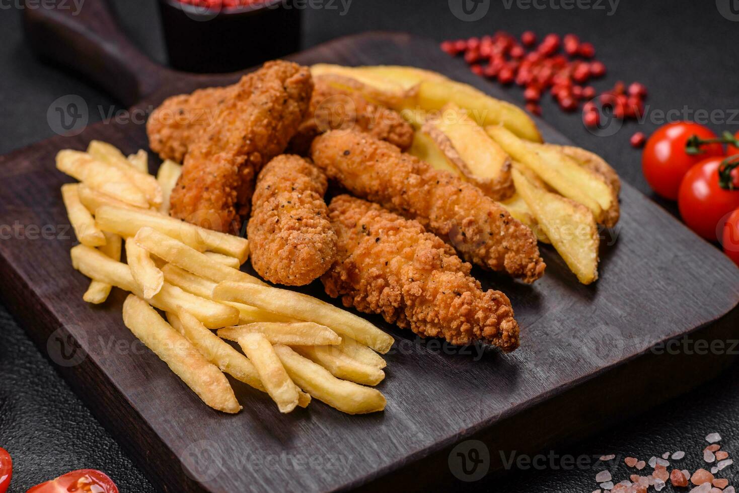 Delicious crispy chicken nuggets breaded with salt and spices photo