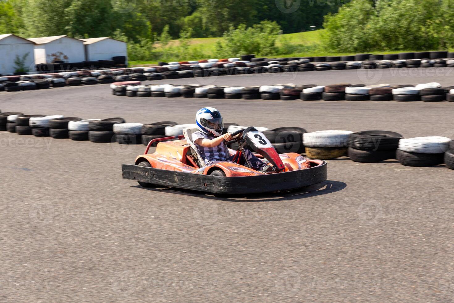 Youth Go Kart Racer on track. photo