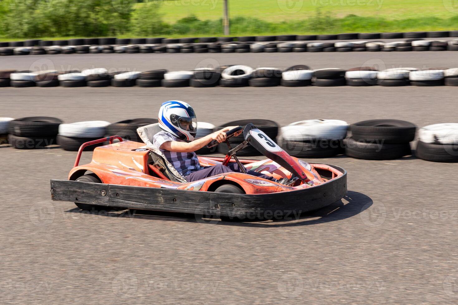 Youth Go Kart Racer on track. photo