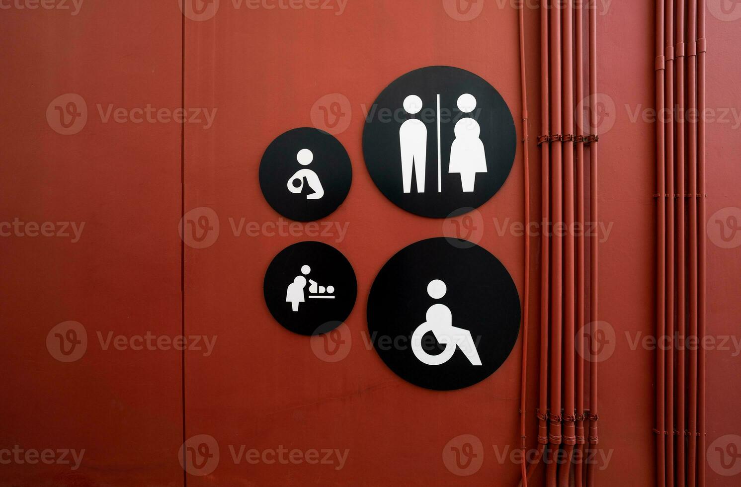 Public toilet sign. Woman, men, children, baby diaper changing, and disabled person toilet icon on restroom wall. Public restroom universal icon. Disabled access symbol. Latrine or WC. Washroom sign. photo