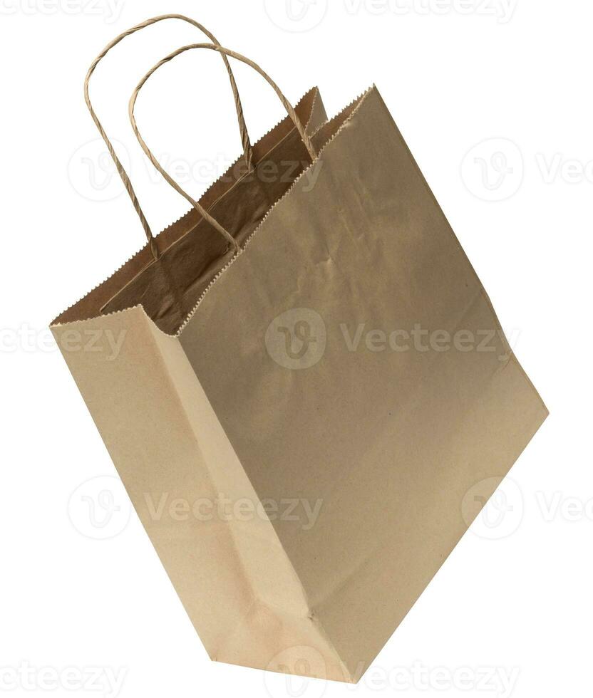Large disposable brown kraft paper bag with handles isolated on white background, eco packaging, zero waste photo