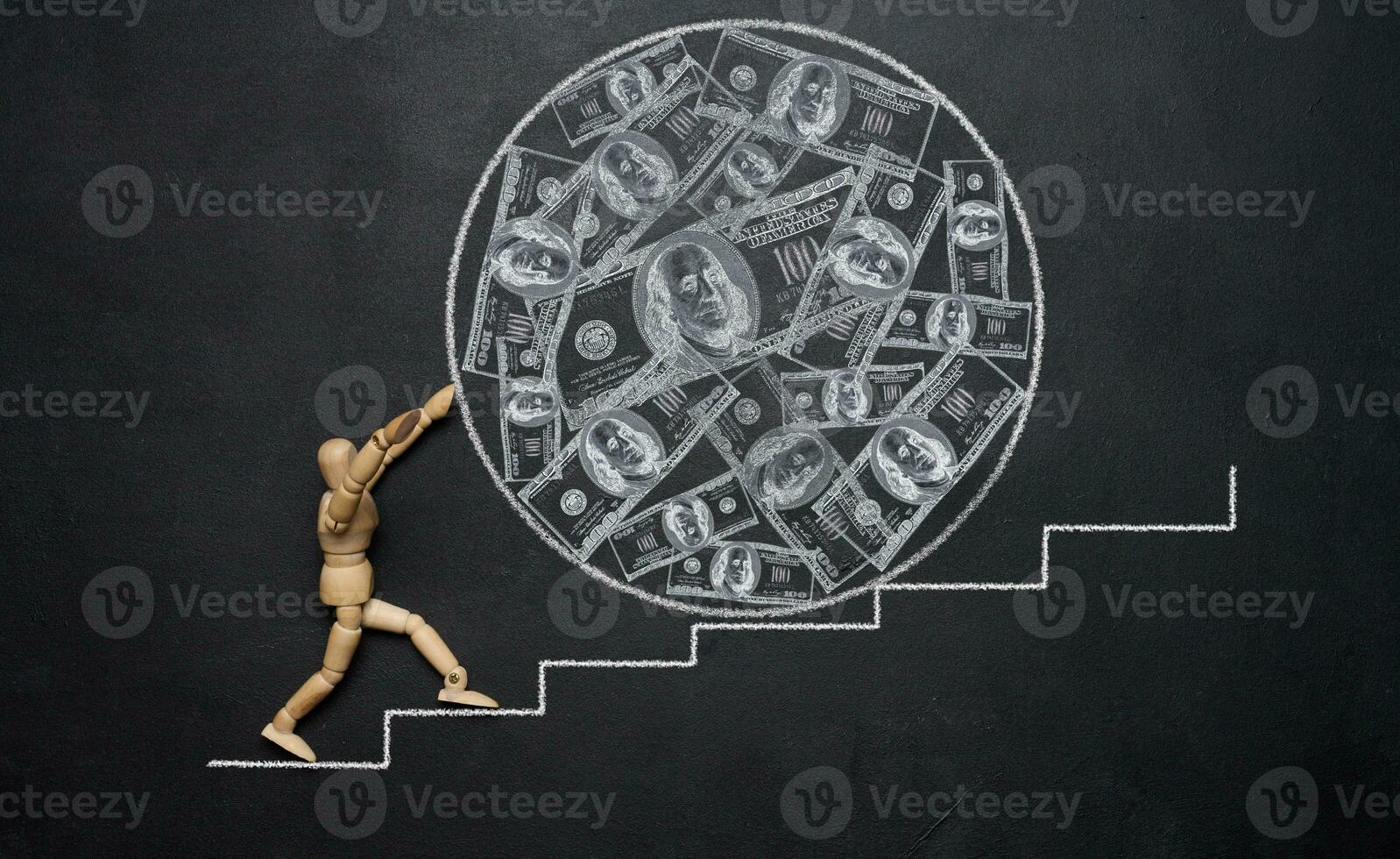 A wooden mannequin rolling a large ball with drawn dollars down the stairs, symbolizing the concept of wealth and hard work towards achieving goals. Inflation and increase in money supply photo