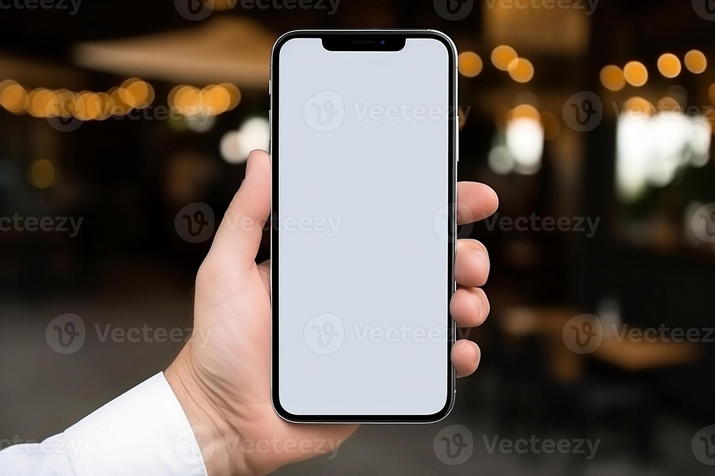 Hand with phone, white screen. photo