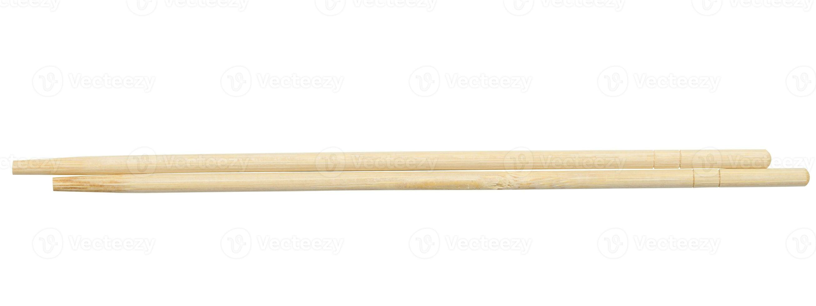 Two wooden chopsticks on a white isolated background photo