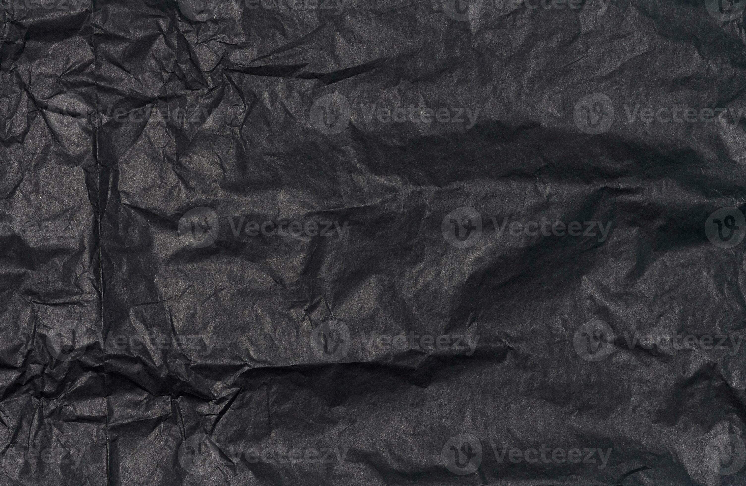 Crumpled sheet of black parchment paper, abstract background 27529499