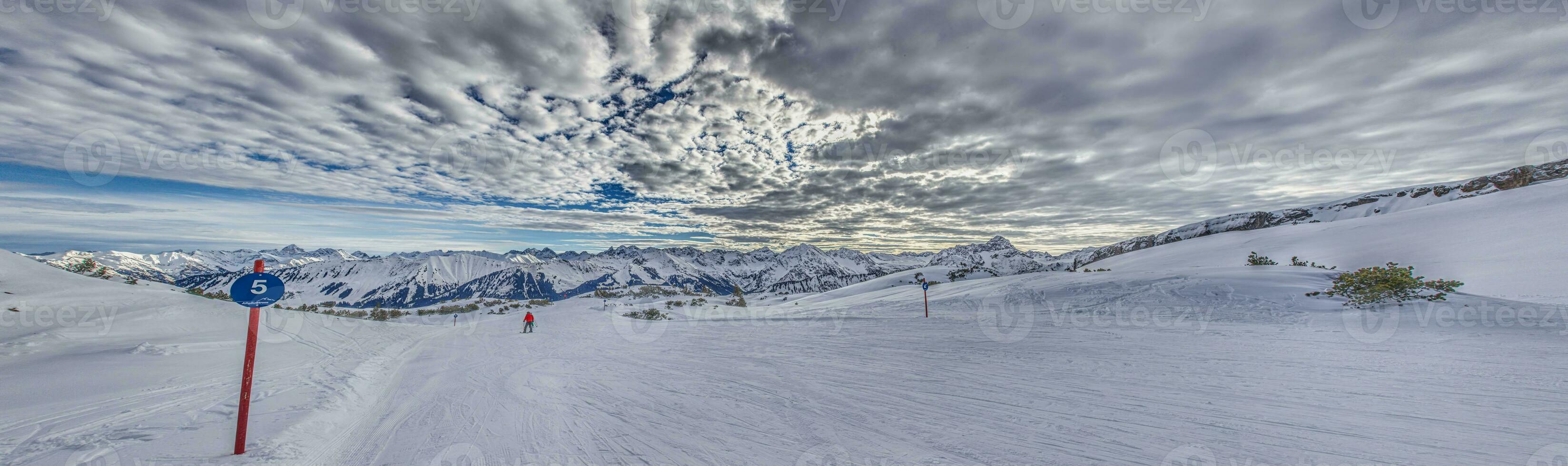Panoramic image of a ski slope in Ifen ski resort in Kleinwalsertal valley in Austria photo