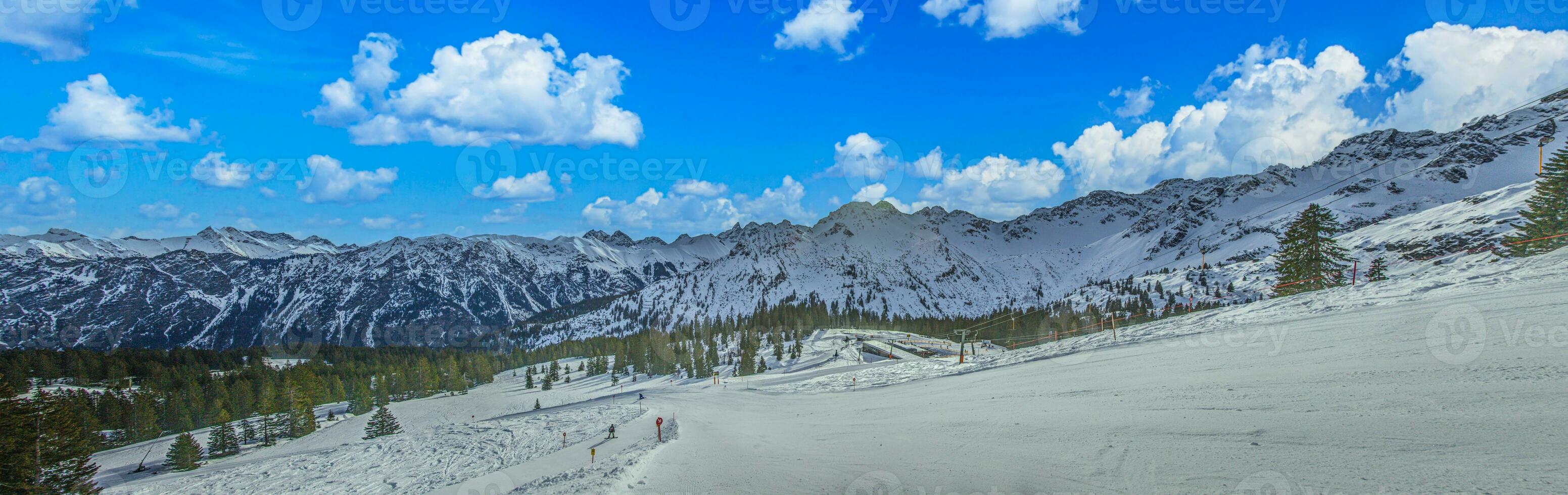 Panoramic image of a ski slope in Ifen ski resort in Kleinwalsertal valley in Austria photo