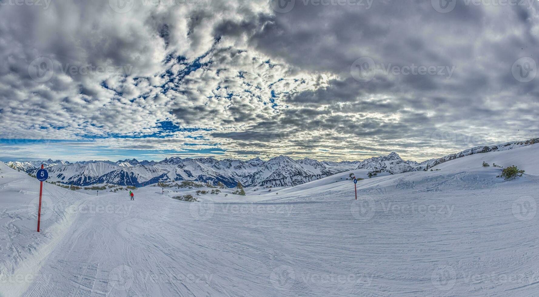 Panoramic image of a ski slope in Ifen ski resort in Kleinwalsertal valley in Austria photo