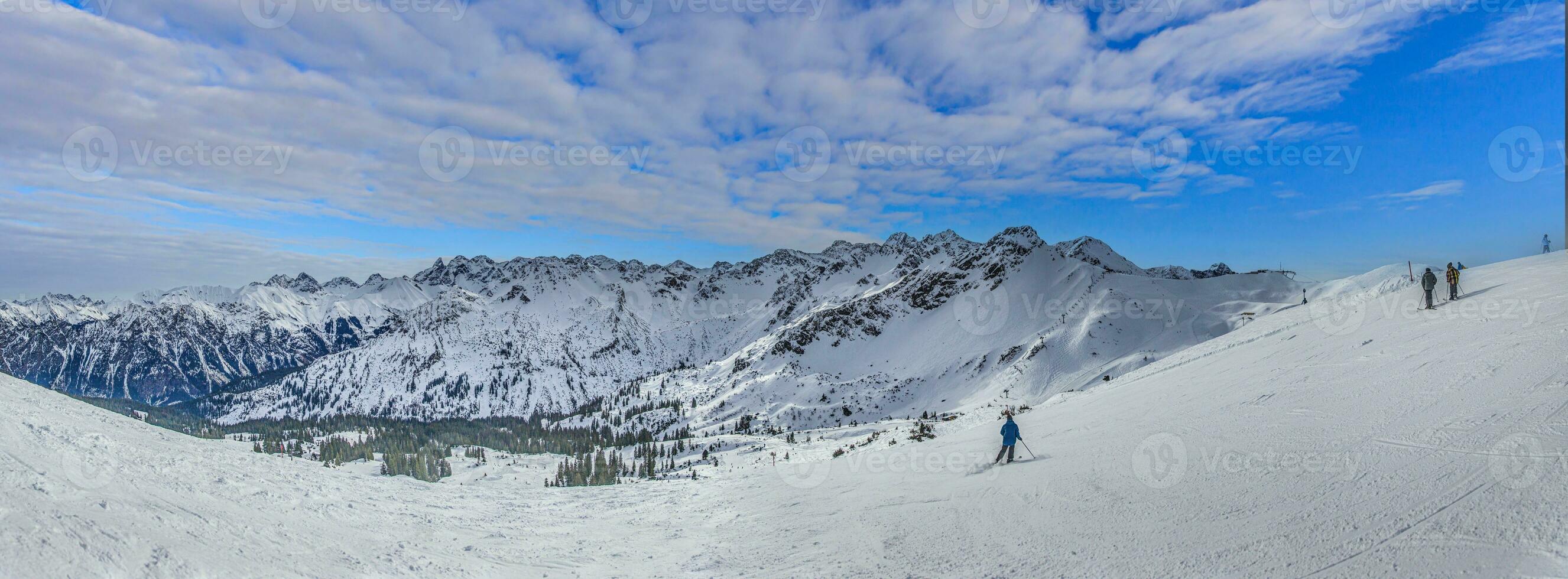 Panoramic image of a ski slope in Ifen ski resort in Kleinwalsertal valley in Austria photo