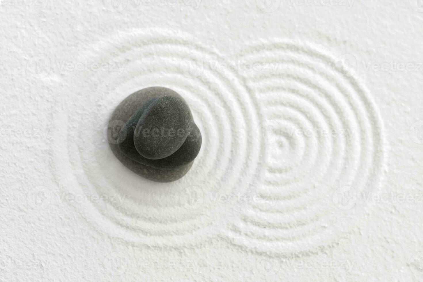 Zen Garden with Grey stone on White Sand Circles Pattern in Japanese stye, Harmony,Meditation,Zen like concept photo