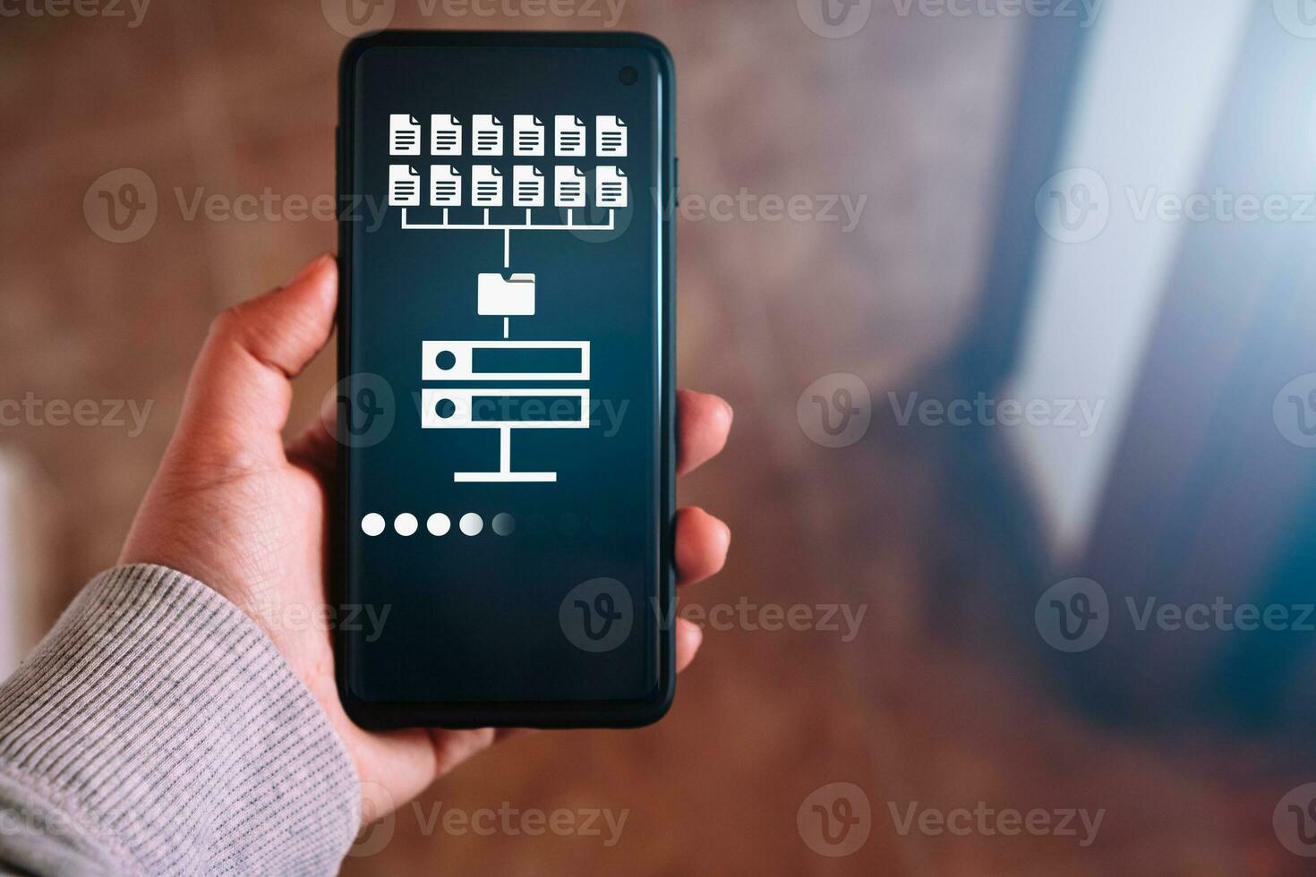 Woman hand showing data host server storage on smartphone screen. Icon for information exchange and transfer concept. photo