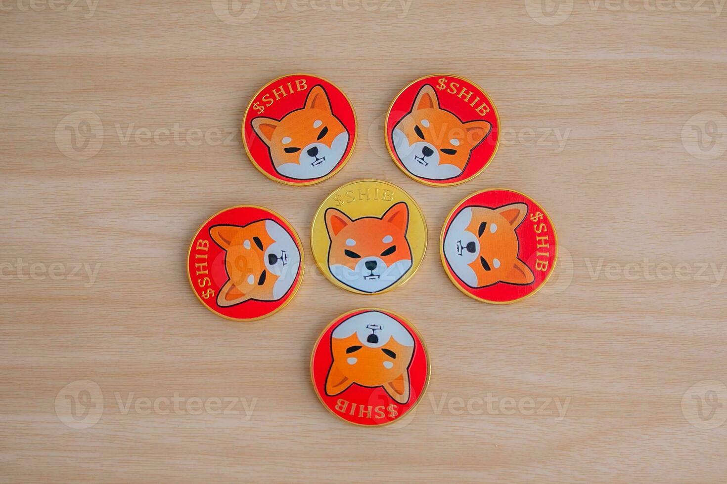 Shiba inu coin SHIB , surrounded by a circle of 5 coins and 1 gold coin in the center, Close up. photo