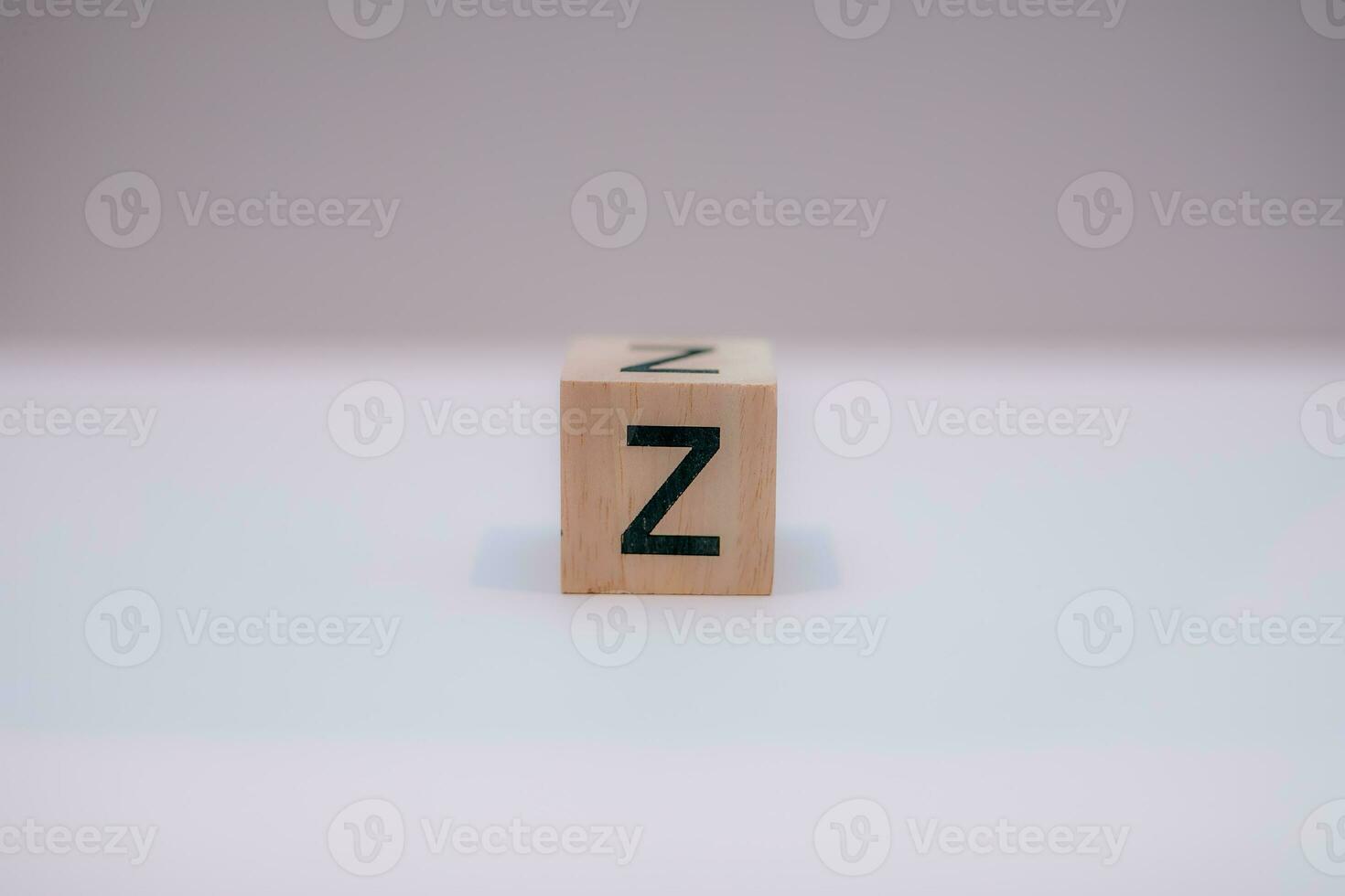 Wooden block written Z with a white background, education concept, close up. photo