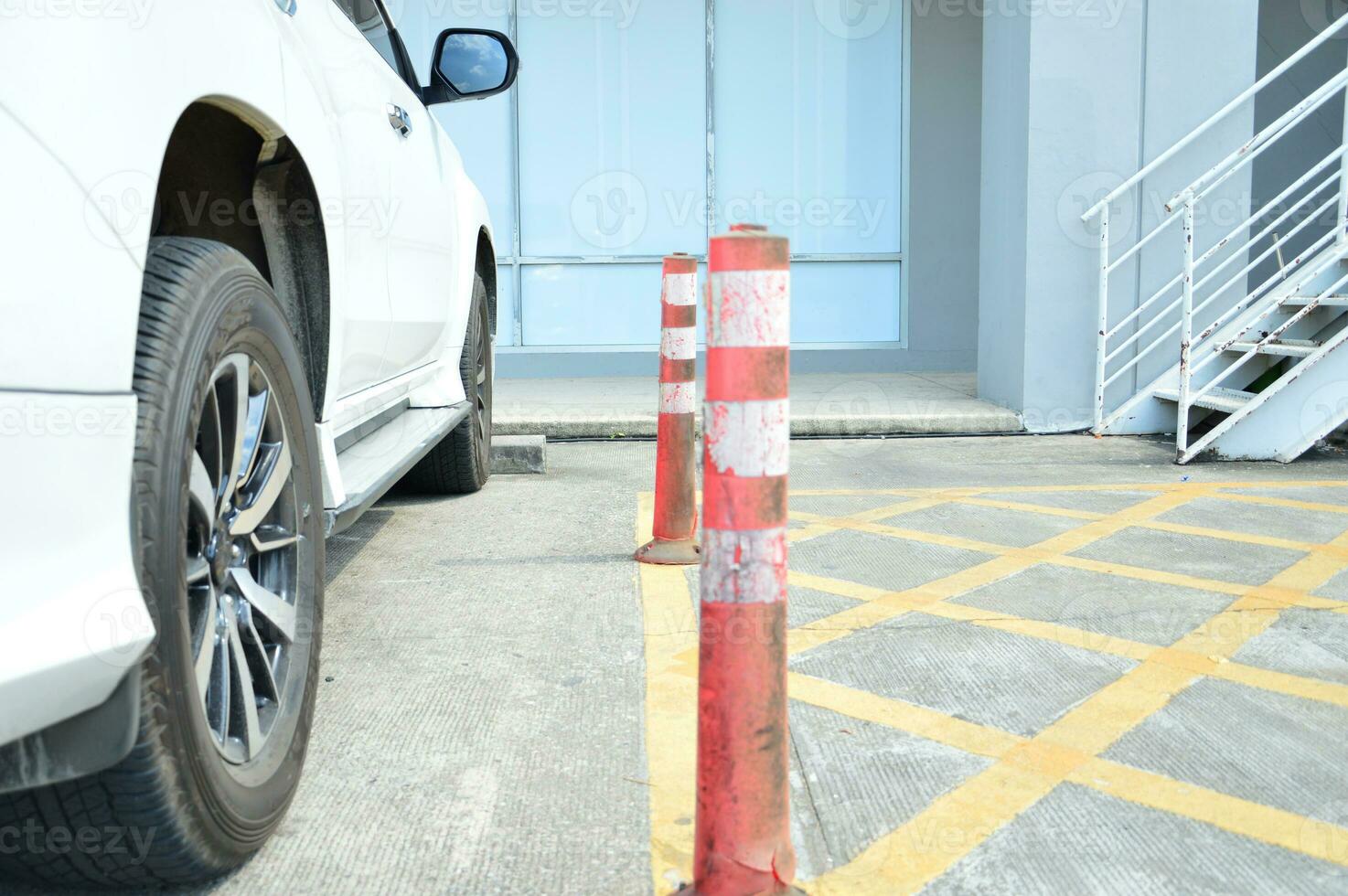 Side view of a car parked in a parking lot. photo