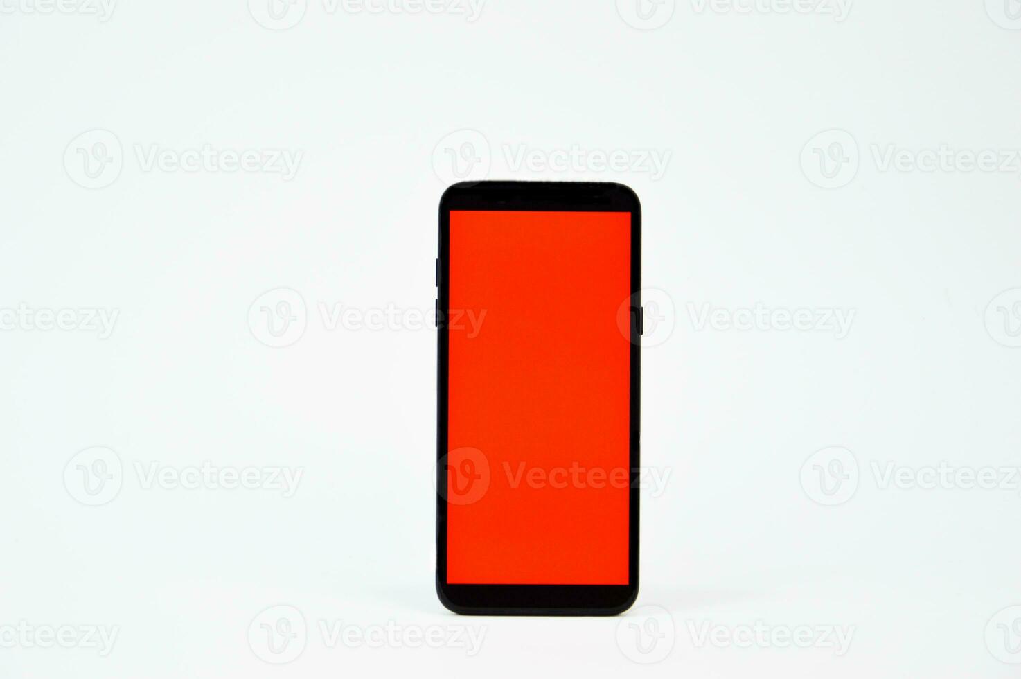 Red screen smartphone on white background photo