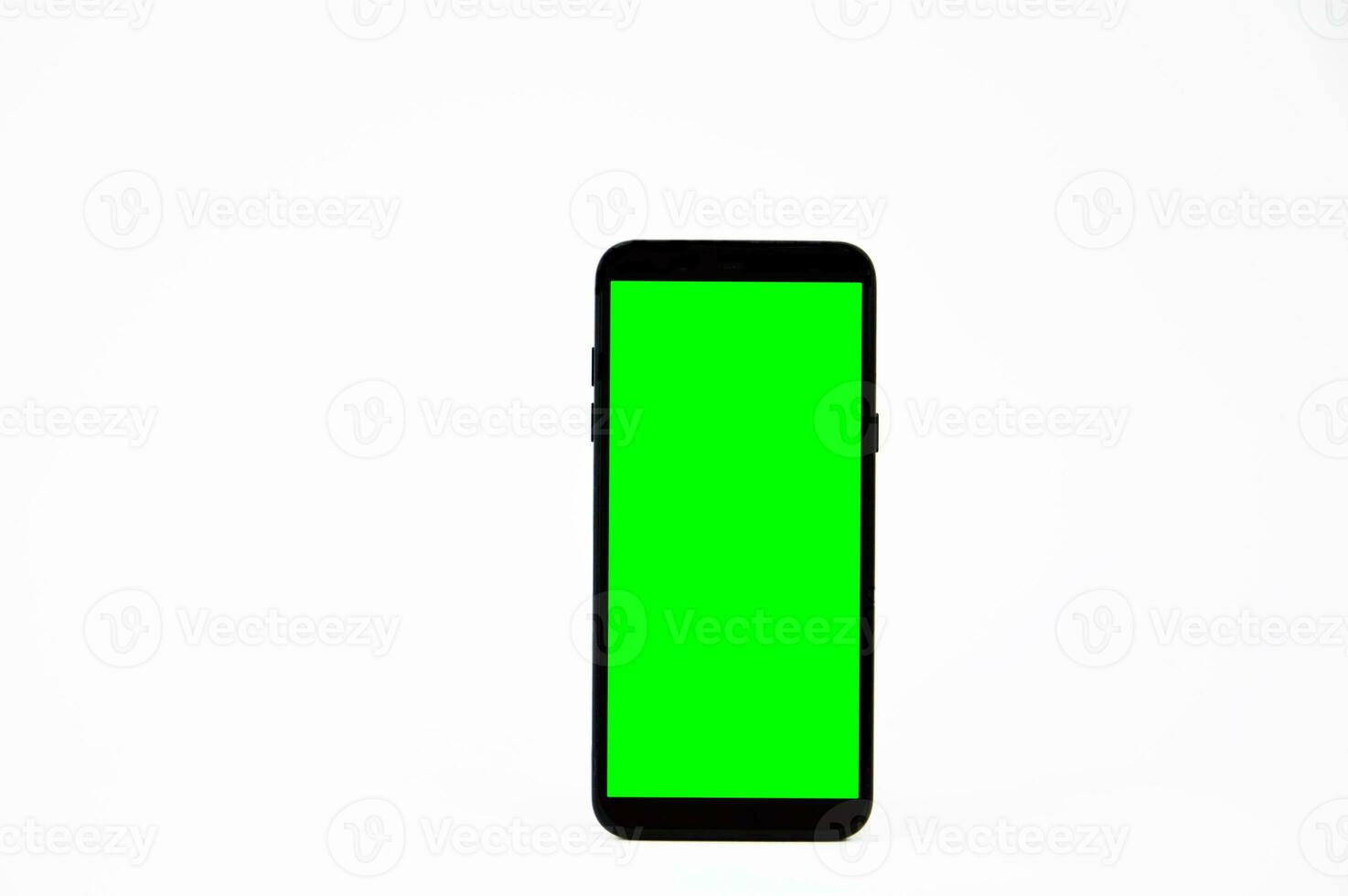 Green screen smartphone on white background photo