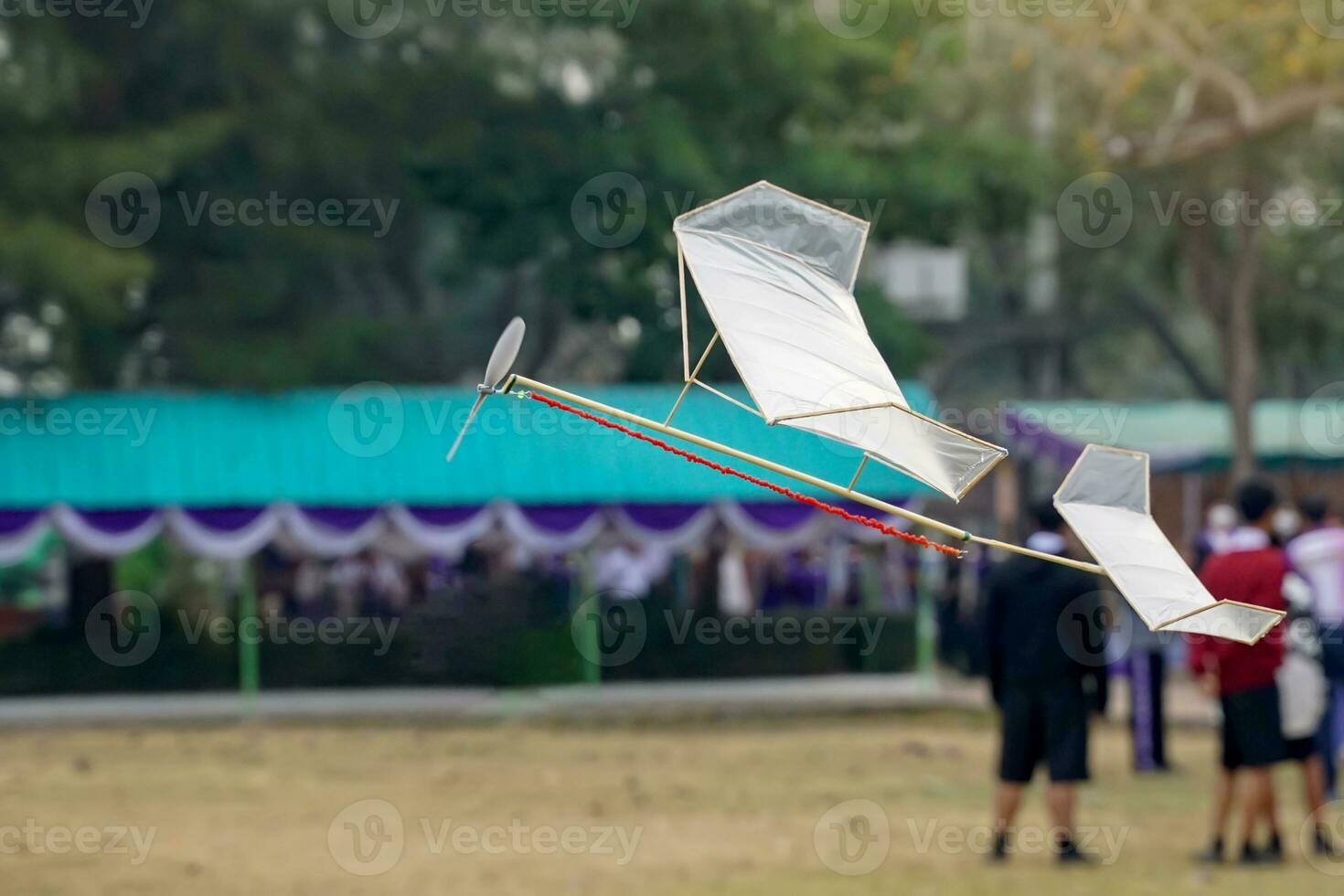 Rubber band powered airplane flies by using the release torque of the rubber to turn the propeller. and lifted up into the air with the force of lift arising from the wings of an airplane. photo