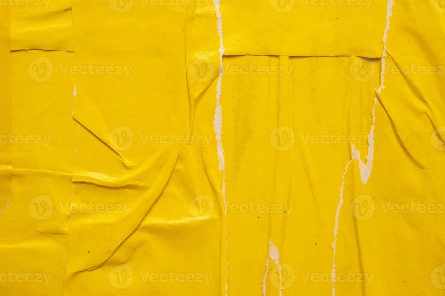 Old grunge ripped torn yellow paper poster surface texture background photo