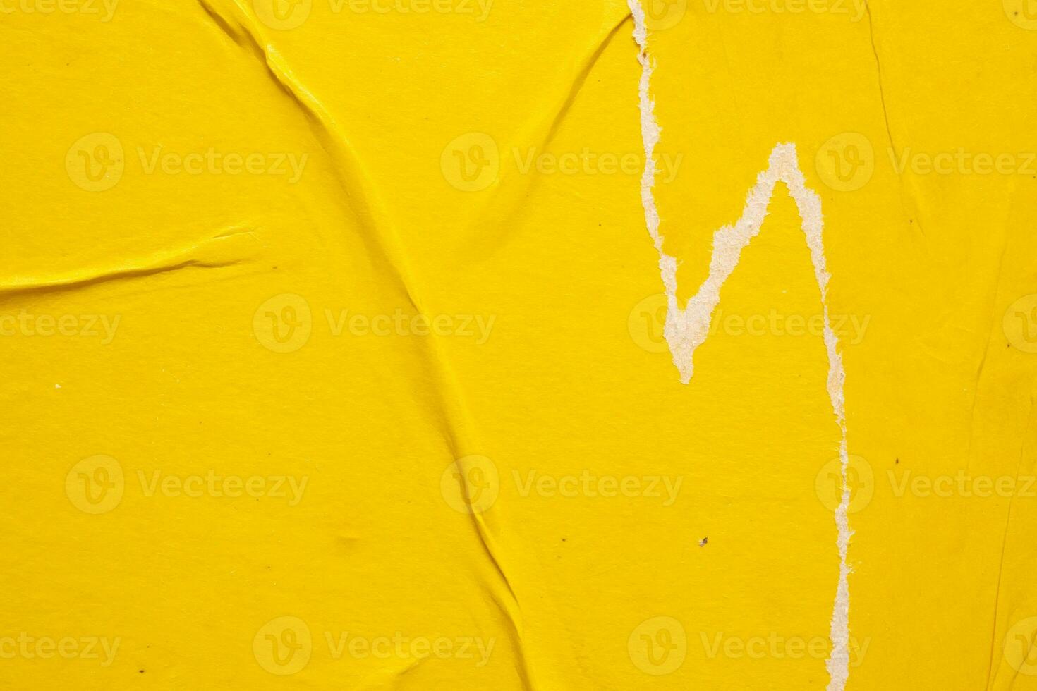 Old grunge ripped torn yellow paper poster surface texture background photo