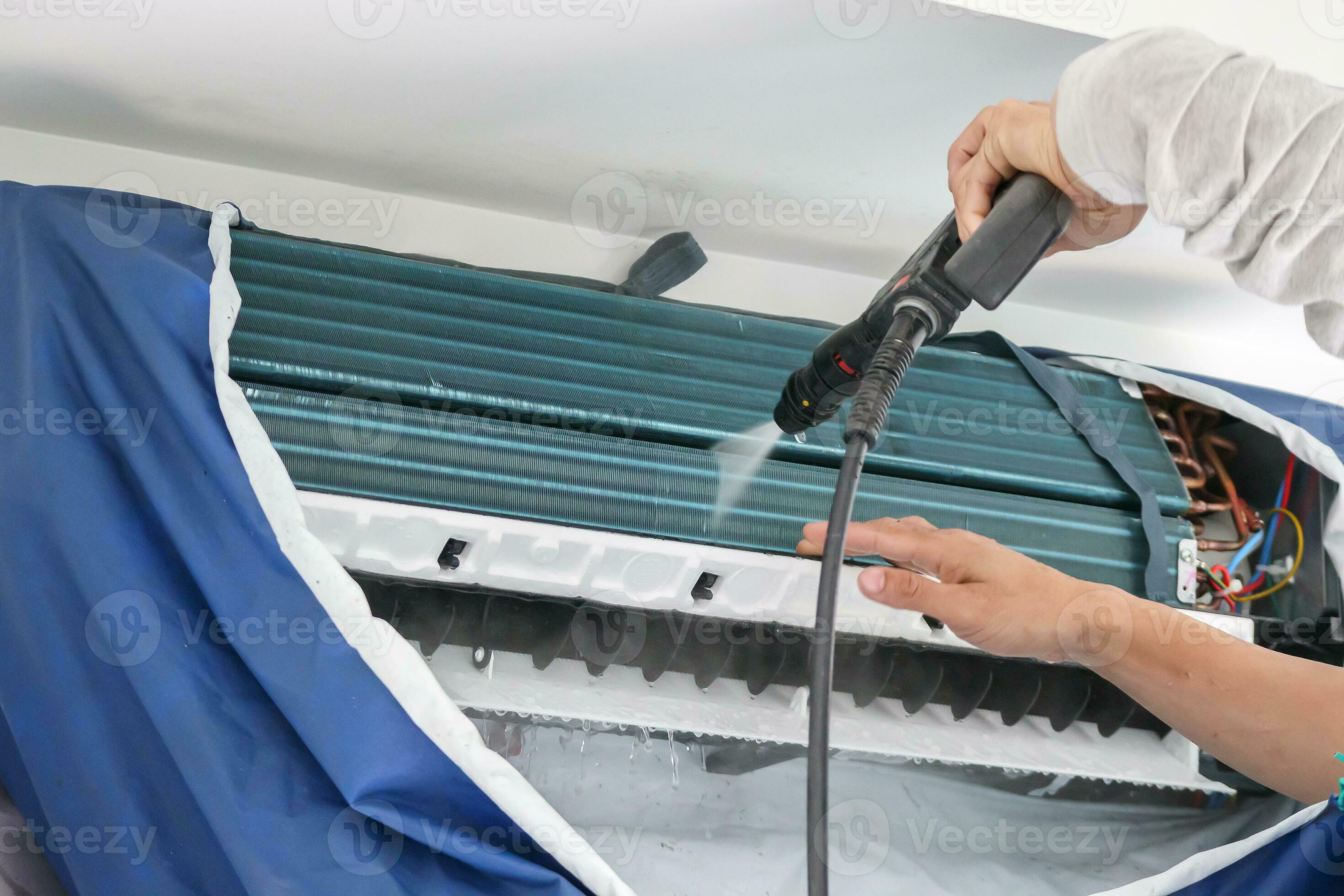 air conditioning cleaning service with water spray 27533583 Stock Photo