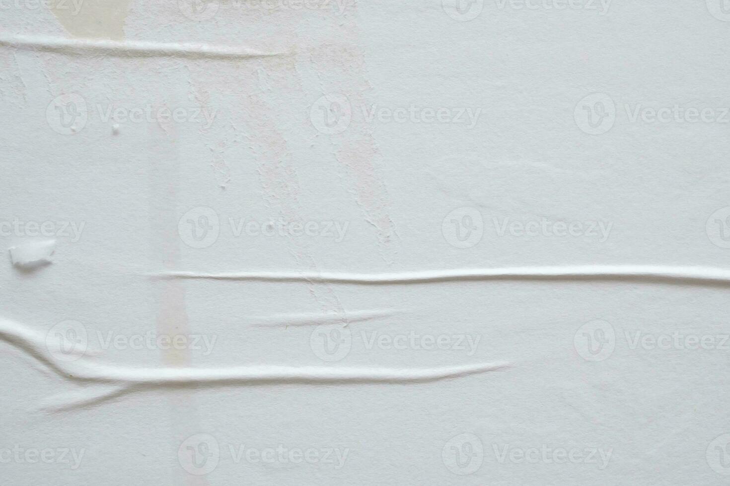 white crumpled and creased paper poster texture background photo
