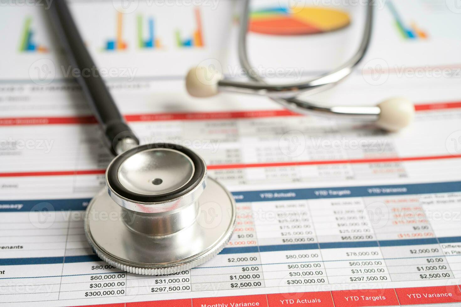 Stethoscope on spreadsheet and graph paper, Finance, Account, Statistics, Investment, Analytic research data economy and Business company concept. photo