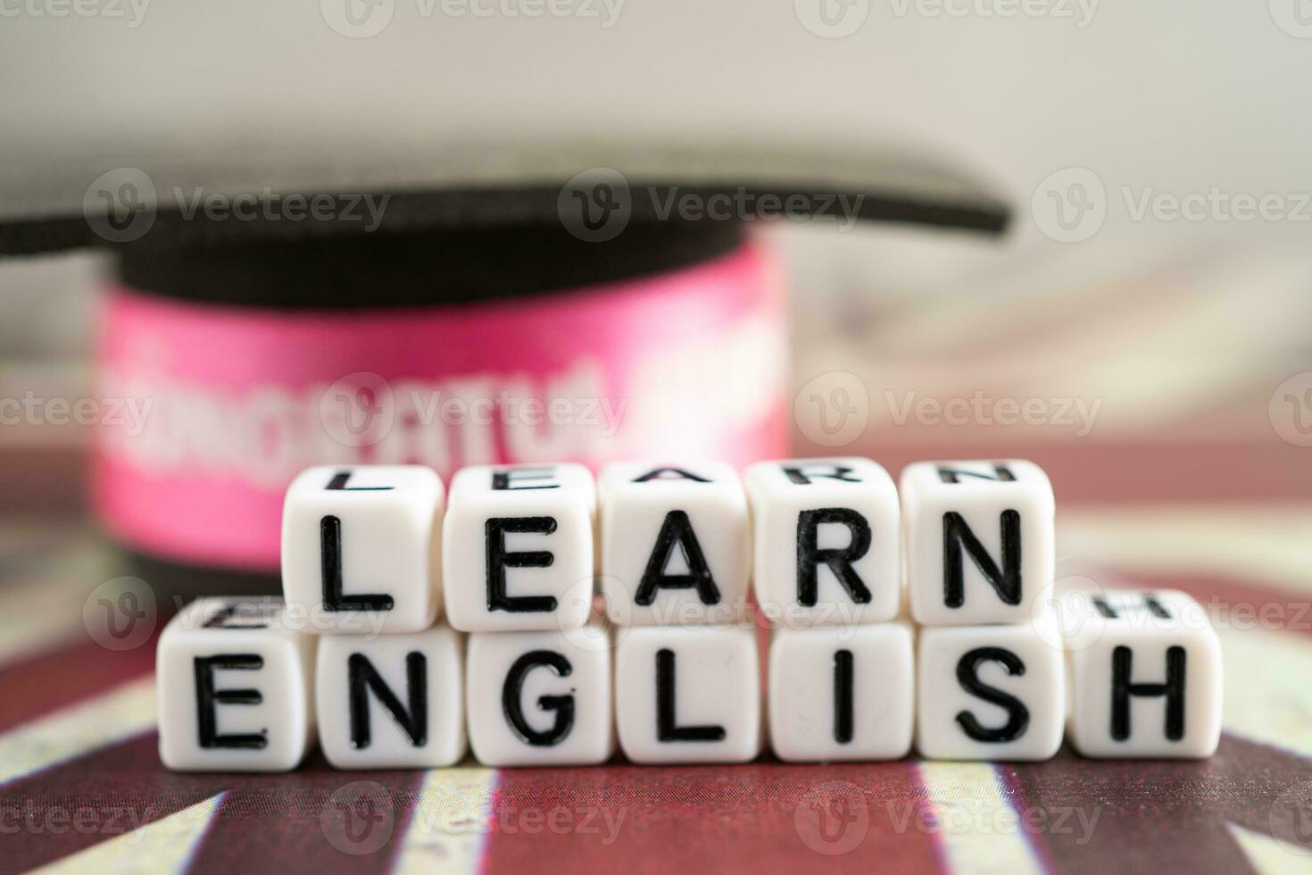 Word Learn English on book with United Kingdom flag, learning English language courses concept. photo