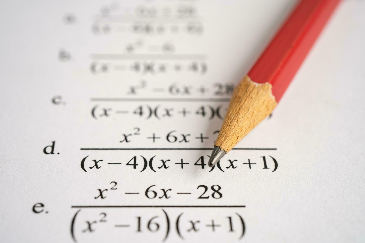 Pencil on mathematic formula exercise test paper in education school. photo
