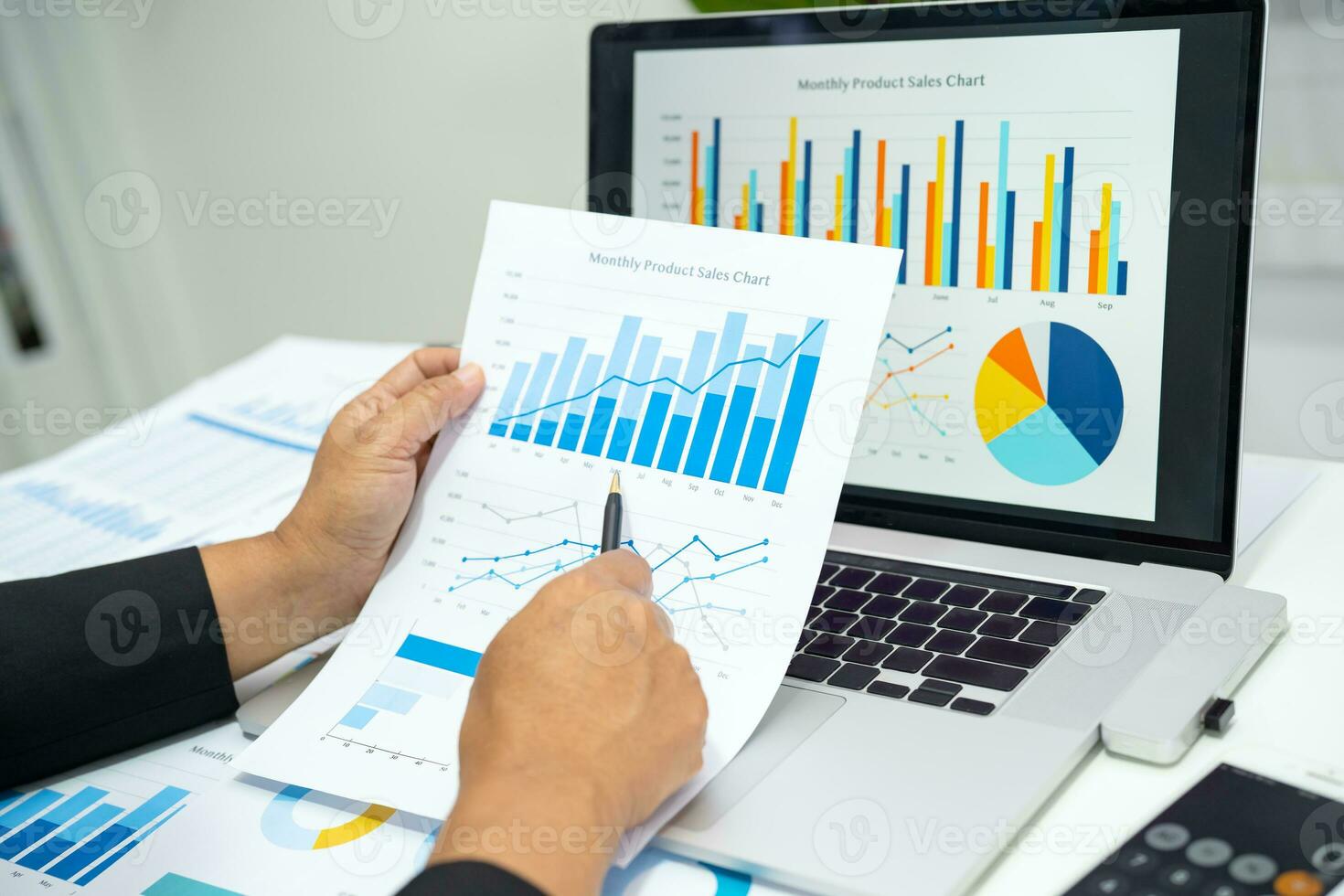 Asian accountant working and analyzing financial reports project accounting with chart graph in modern office, finance and business concept. photo