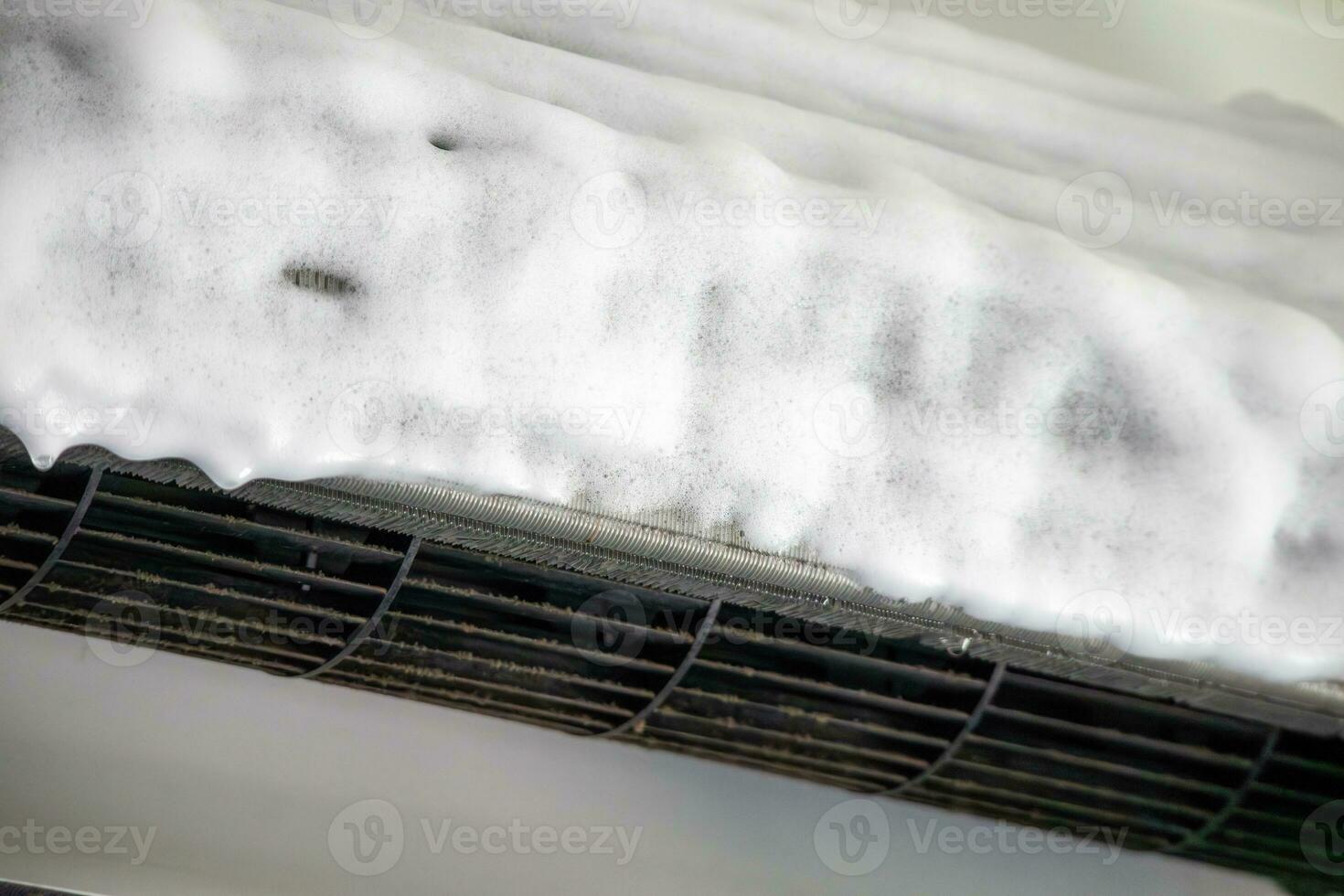 air conditioner cleaning with spray foam cleaner photo