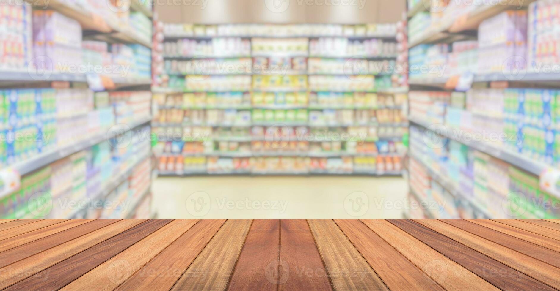 Empty wood table top with supermarket blurred background for product display photo