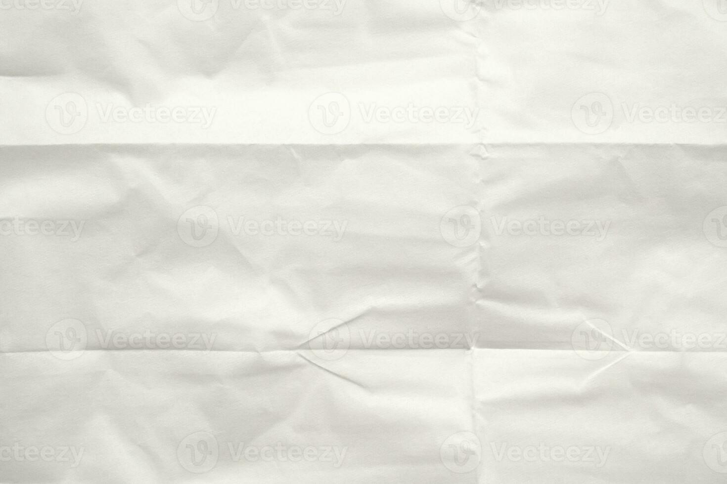 White folded and wrinkled paper texture background photo