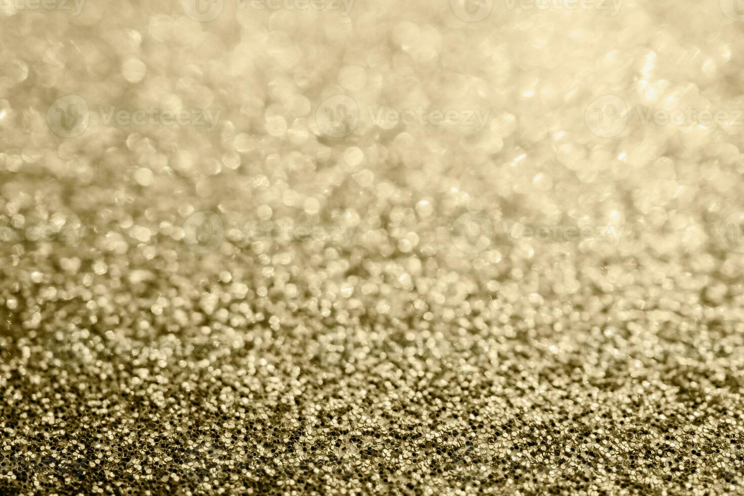 Abstract gold glitter sparkle blurred with bokeh background photo