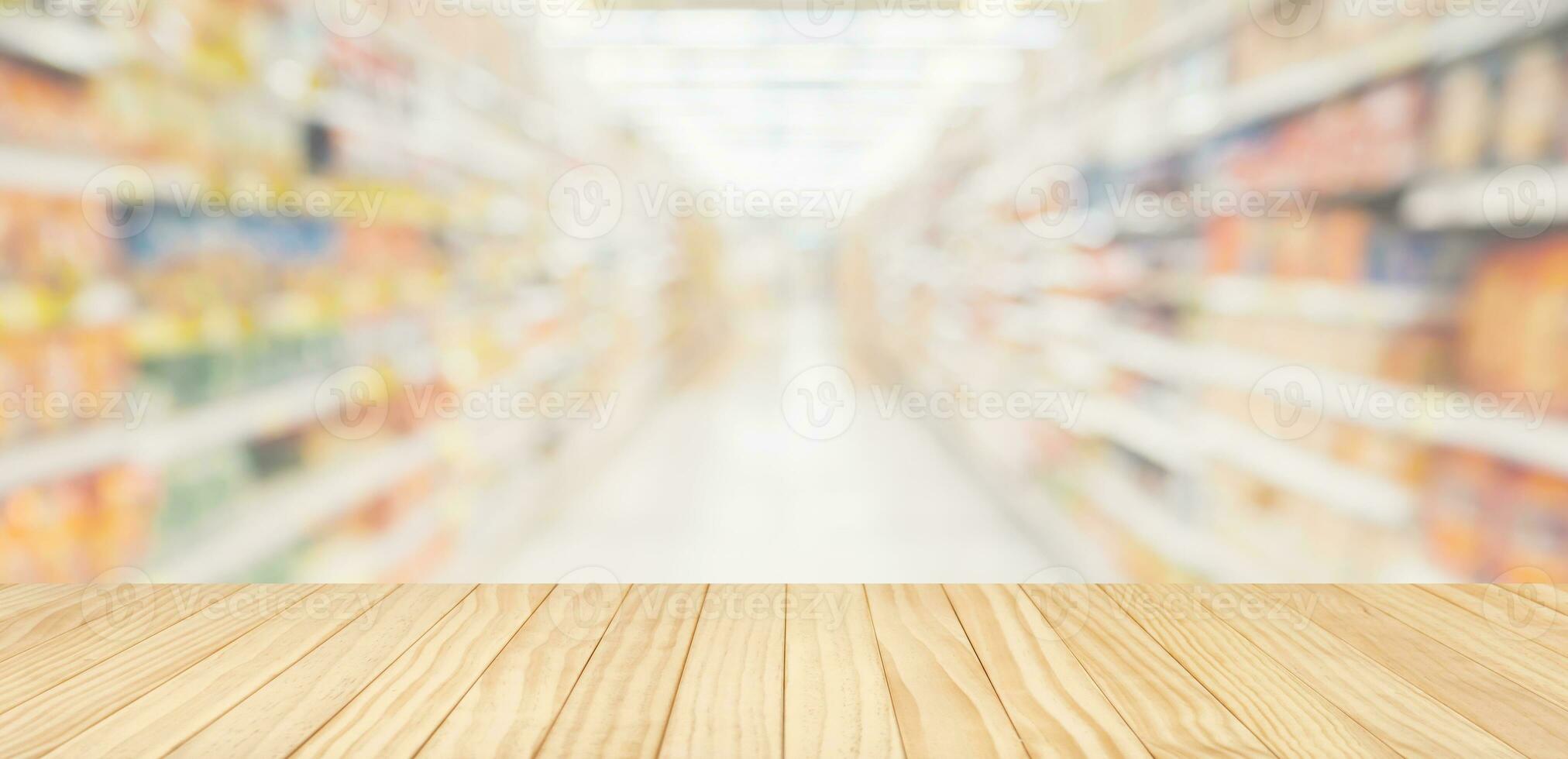 Empty wood table top with supermarket blurred background for product display photo