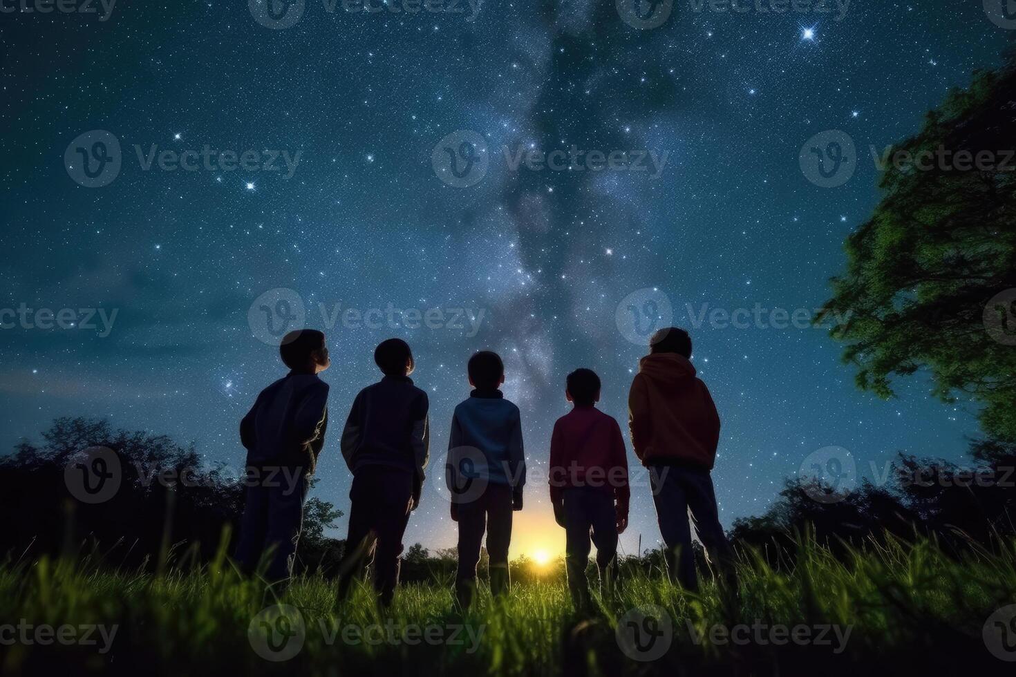 Children of diverse backgrounds gaze in wonder at starry night sky in outdoor fantasy scene - photo