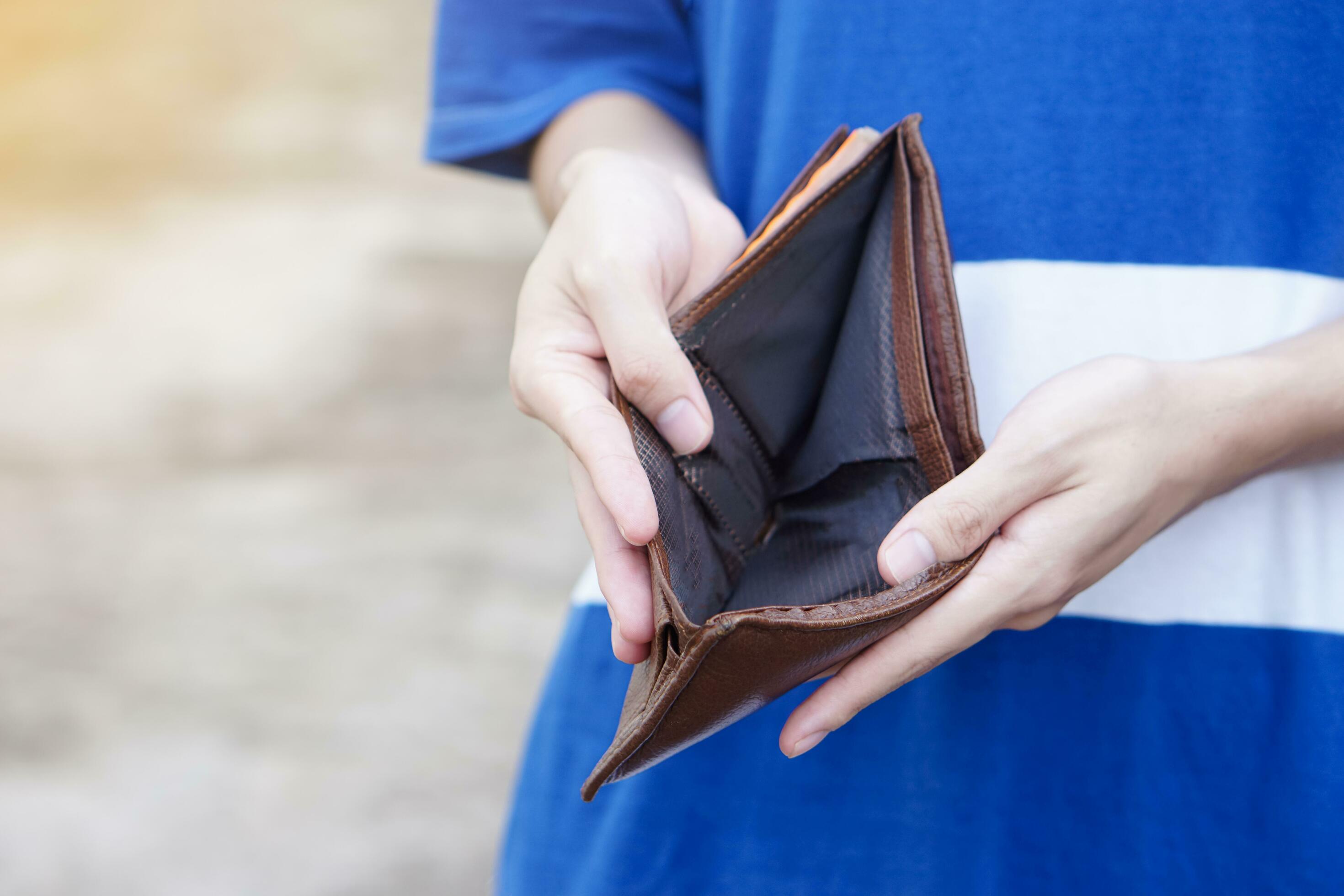 I Have A Product Idea But No Money Close up hands hold empty wallet with no money. Concept, poor, bad