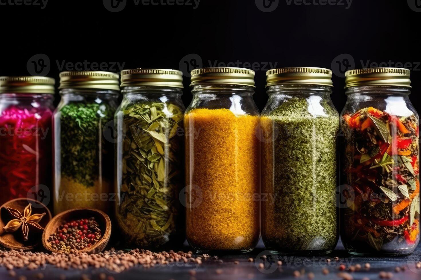 Premium Photo  Spices in glass jars on a pink background