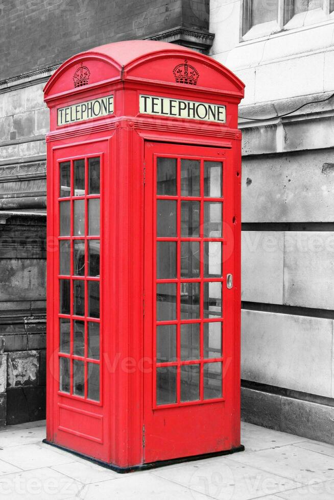 Color isolated red phone booth in London photo