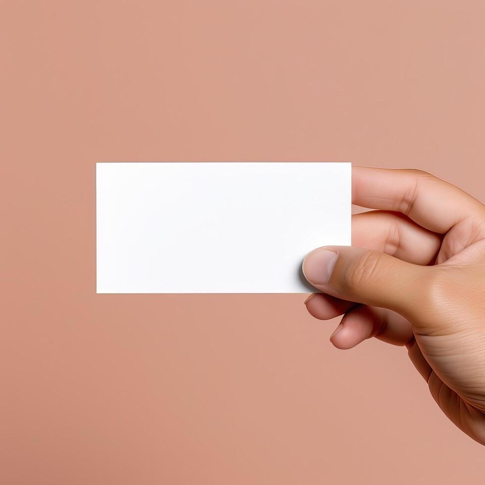 a person holding a business card in his hand photo