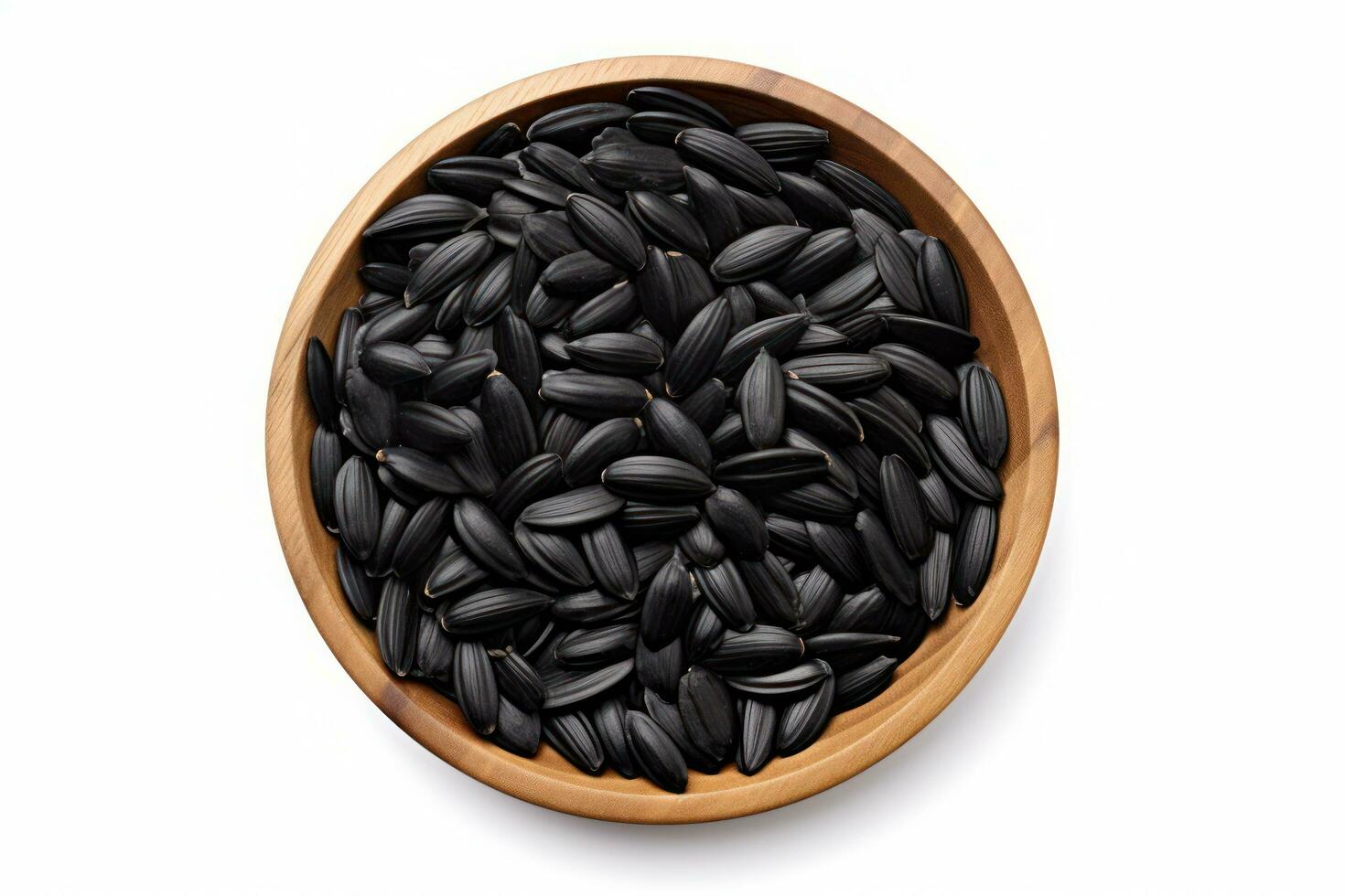 top view black sunflower seeds in a wooden bowl on a white background AI Generated photo