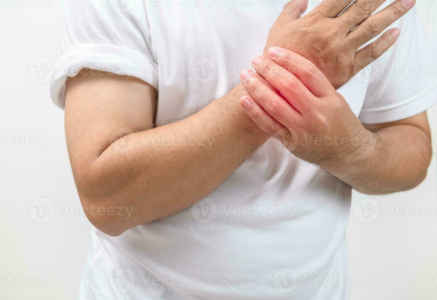 A man felt his wrist hurt and massaging sore zone isolated on white background photo