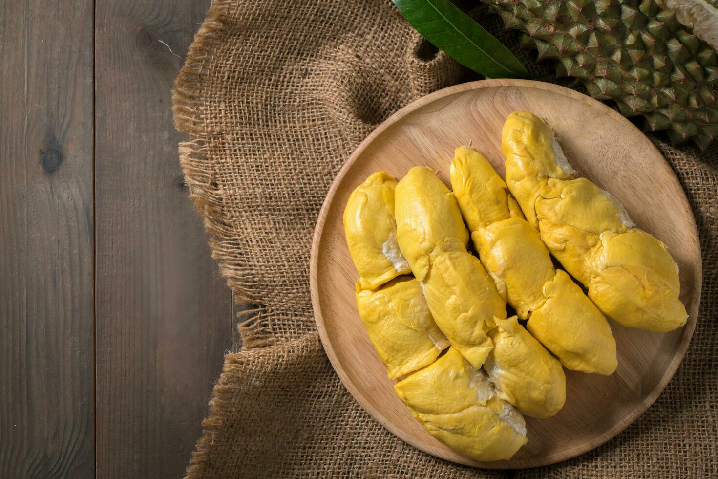 Top view Chani Kai Durian or Durio zibthinus murray on wood plate. KIng of fruits of thailand photo