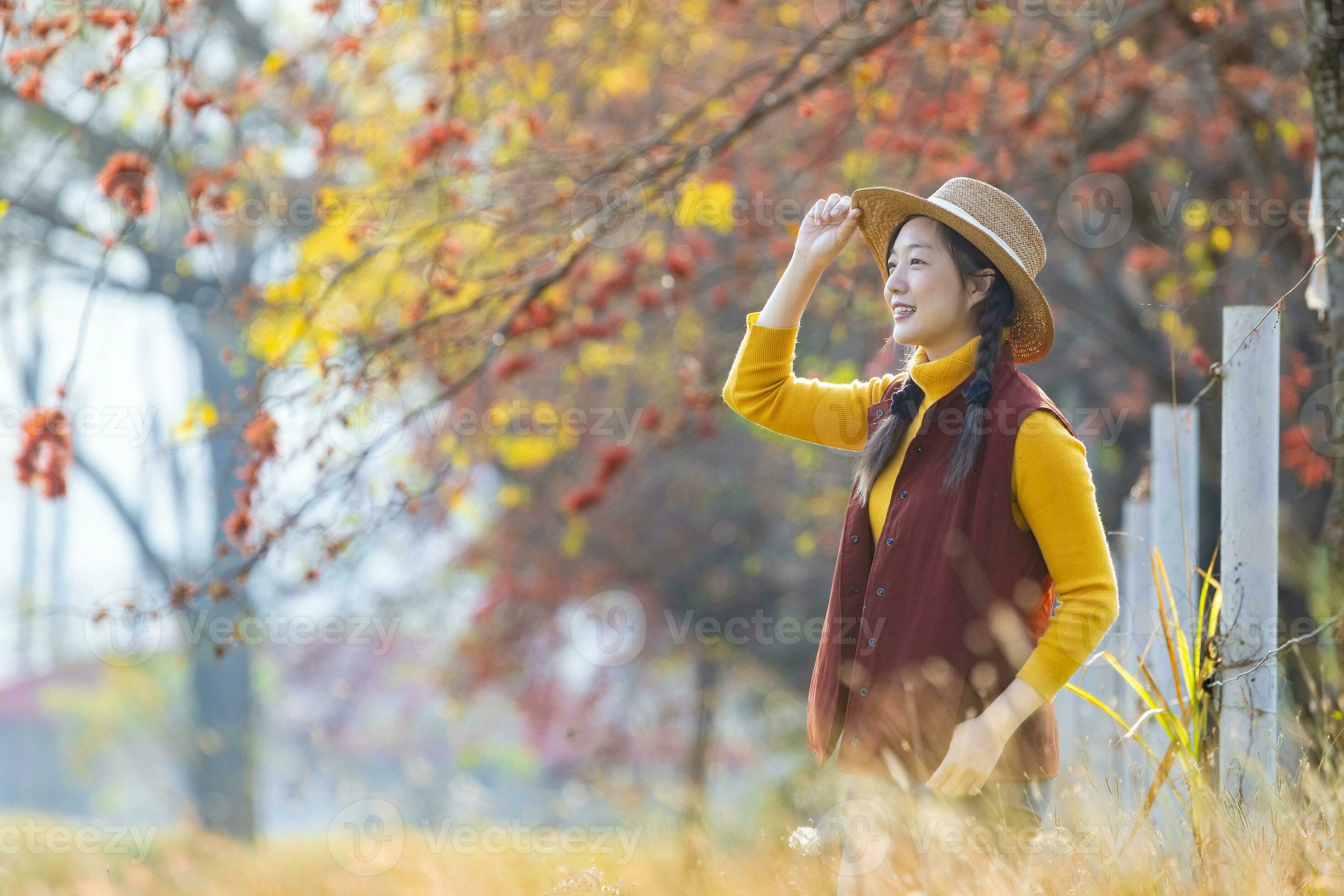 Happy Asian farmer girl portrait in autumnal fashion with fall color