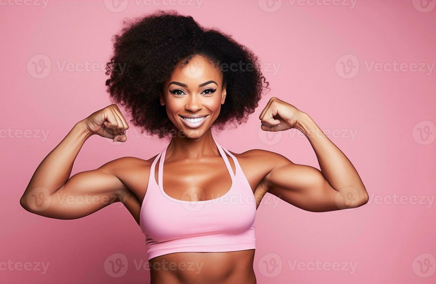 Strong Beautiful Woman Flexing Biceps Stock Photo, Picture and