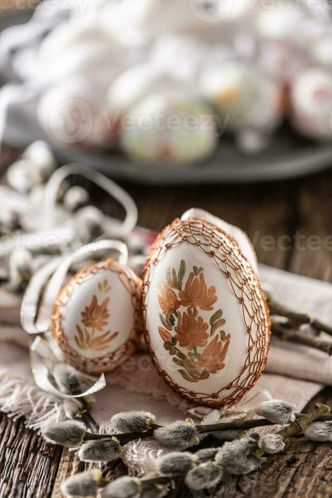 Handmade colorful easter eggs on a linen napkin. photo