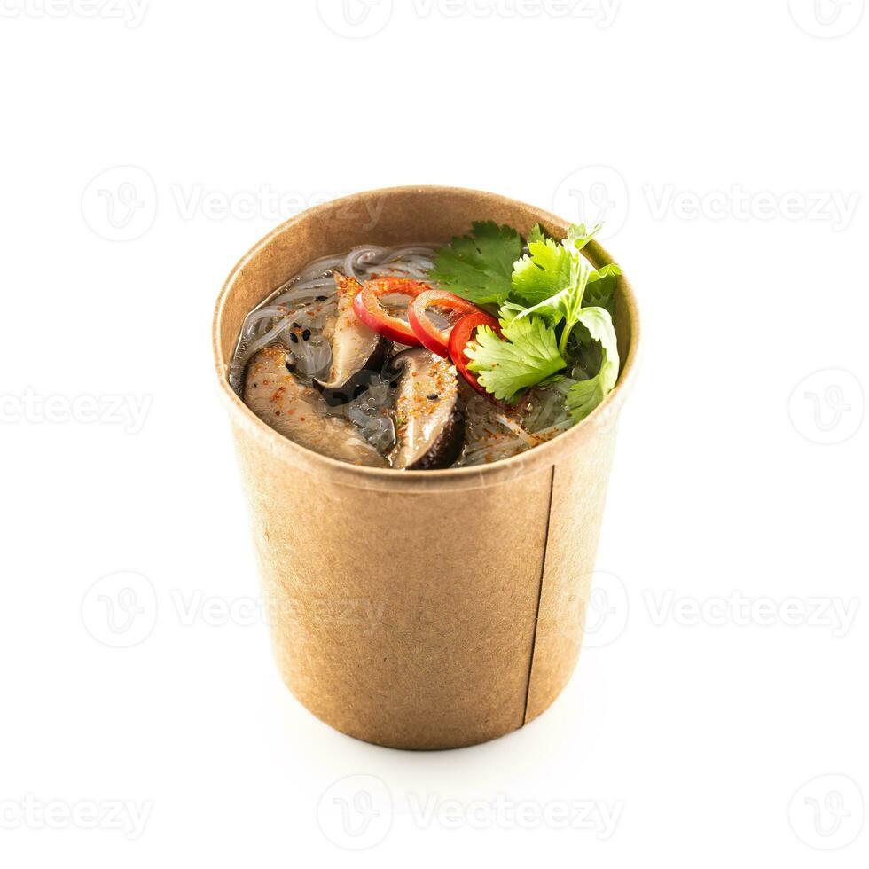 Japanese asian soup in a cup of recycled paper isolated on white background. photo